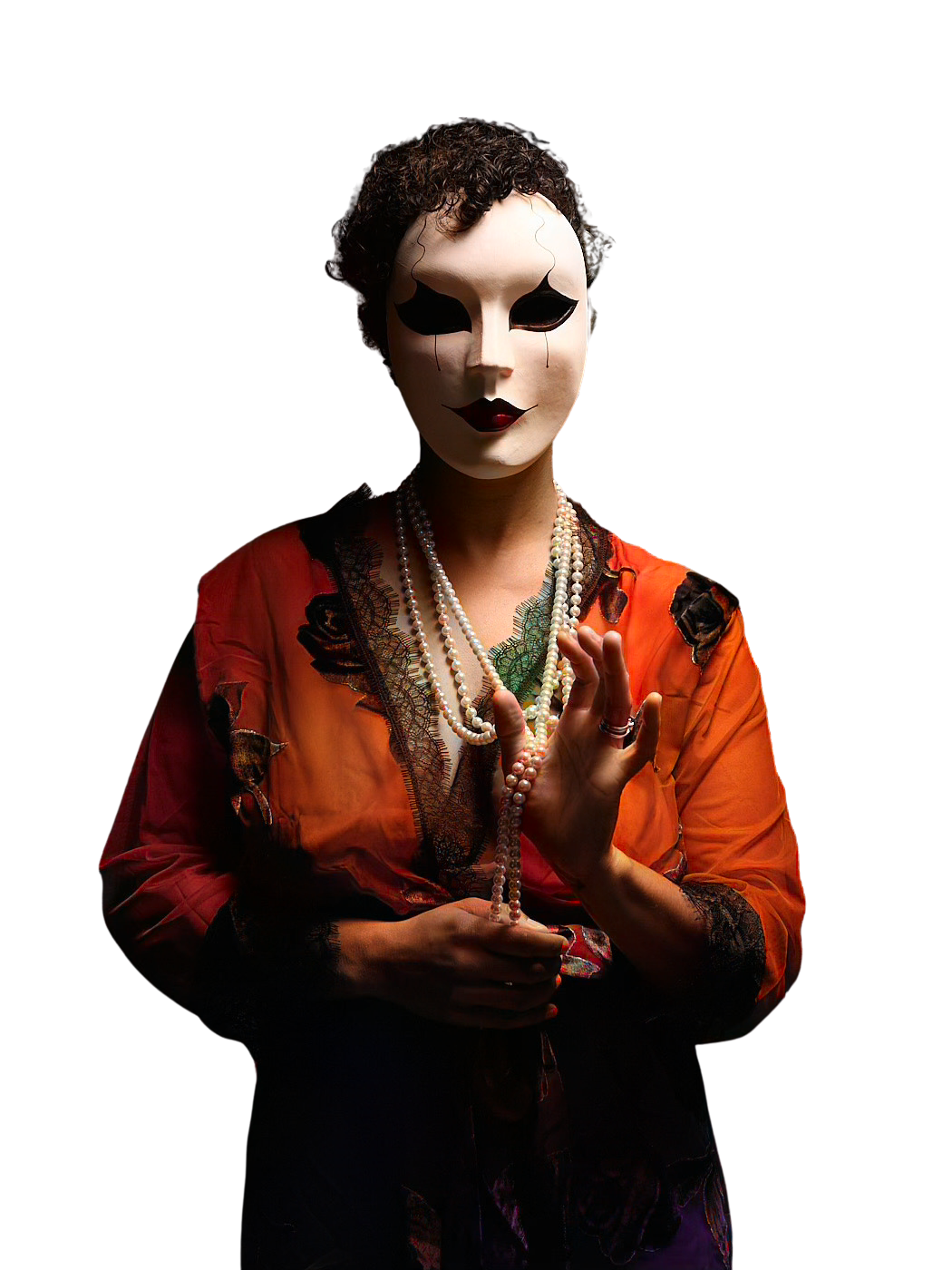 A masked figure wearing a red silk robe with black lace plays with the pearl necklace around her neck.